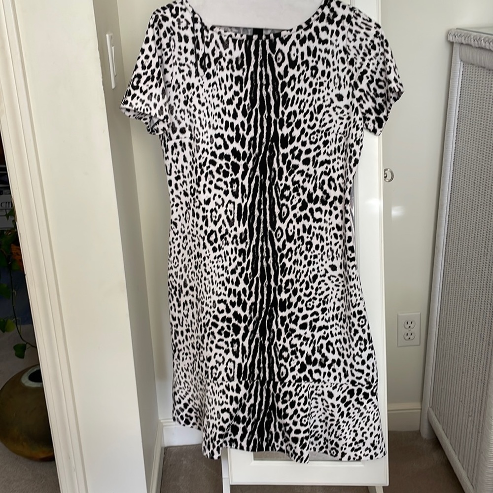 Michael Kors , animal print.  Perfect with a jacket, sweater or alone.